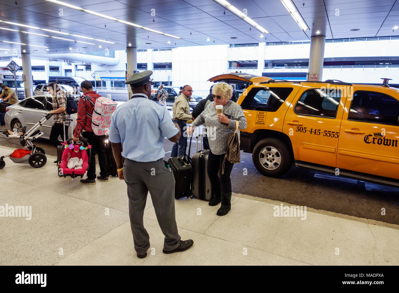 Florida,FL South,Miami,Miami International Airport MIA,terminal gate,departures,curb drop-off,Black Blacks African Africans ethnic minority,adult adul Stock Photo