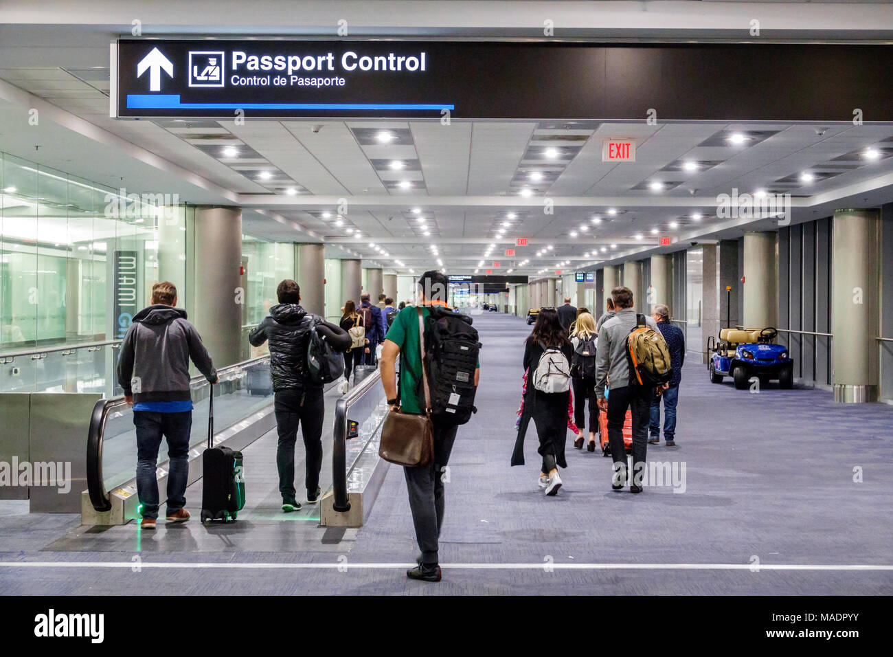 Miami Florida,International Airport MIA,Passport Control,arriving passengers,man men male,woman female women,moving walkway,interior inside,FL17120300 Stock Photo