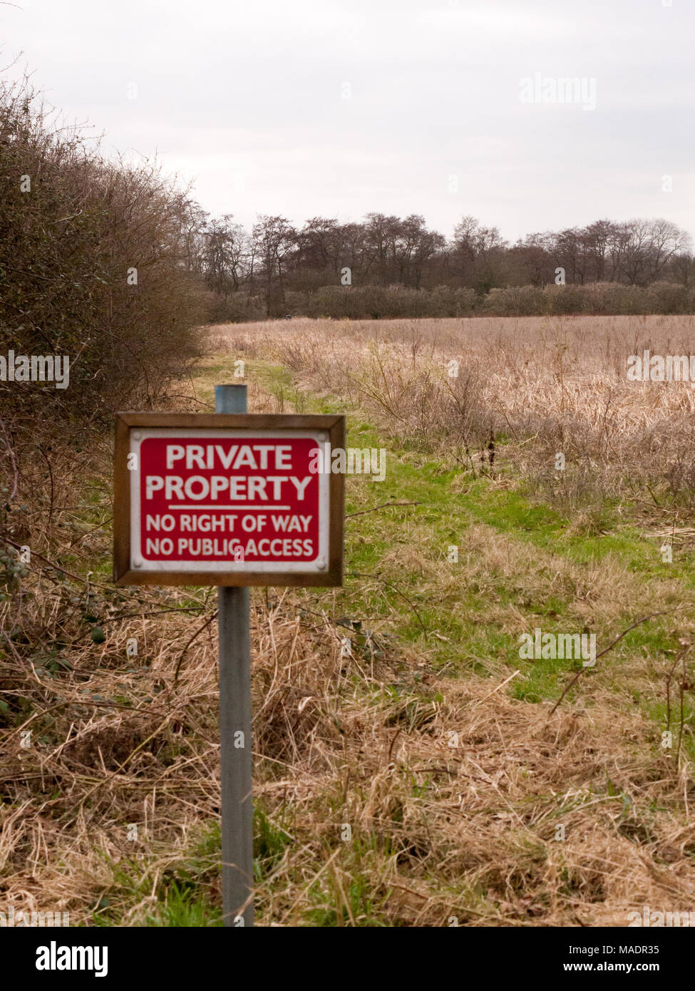 red wooden private property sign farm land no right of way no public