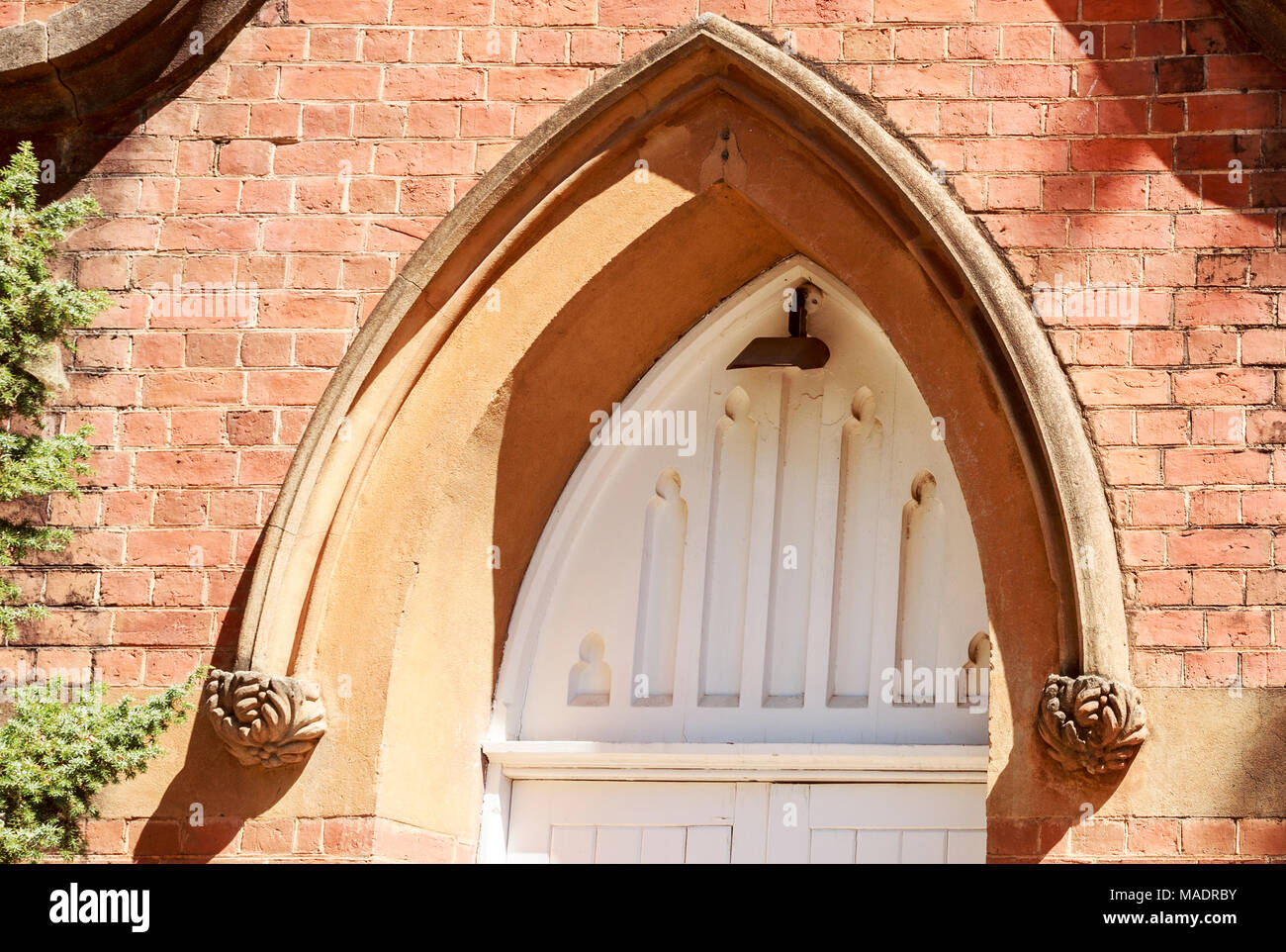 Detail of the arch above the door of St John Uniting Church in Narrandera, New South Wales, Australia Stock Photo