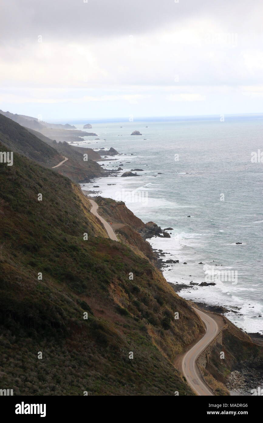 Highway One curves along the dramatic coastline of Big Sur, California ...