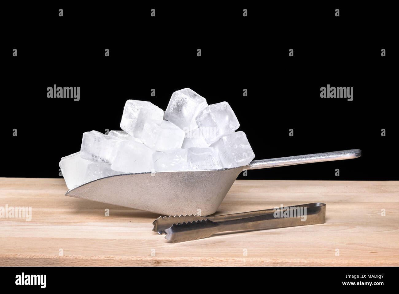 Time lapse of a large scoop of ice cubes melting over three hours. Room