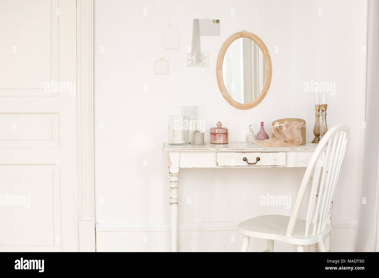 Vintage table and mirror and chair indoors Stock Photo Alamy