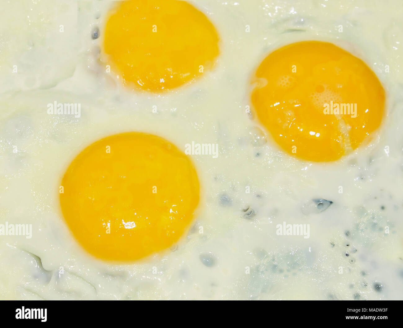 https://c8.alamy.com/comp/MADW3F/omelette-of-three-eggs-in-the-background-MADW3F.jpg