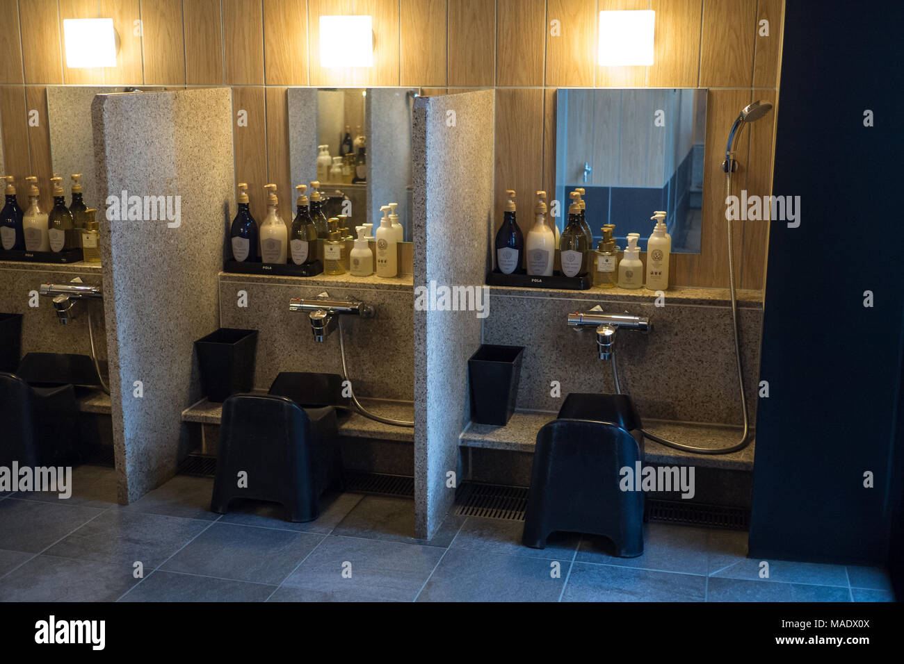 Shower cubicle in the private indoor onsen at the Candeo Hotel in Osaka Stock Photo