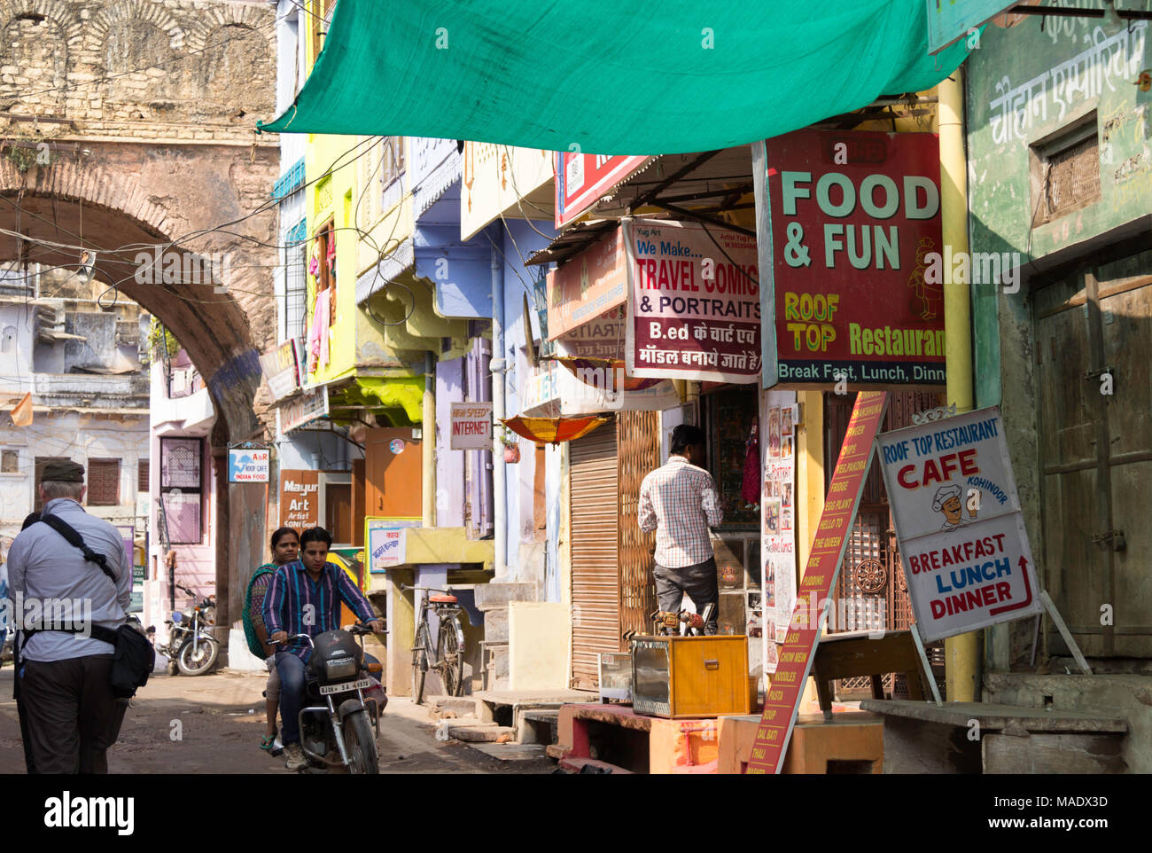 Street scene in Bundi, Rajasthan, India, with food signs and shops. Stock Photo