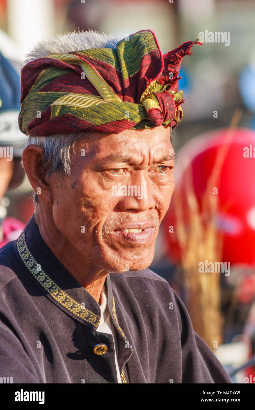 Portrait of Balinese man wearing headgear, Sanur, Bali, Indonesia Stock Photo