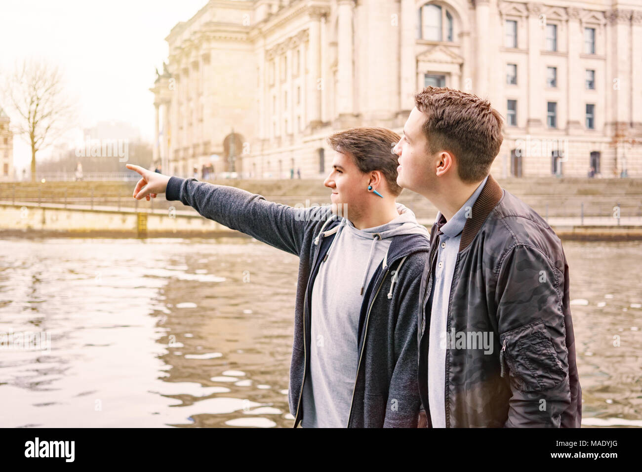 two male tourists exploring government district in Berlin Germany Stock Photo