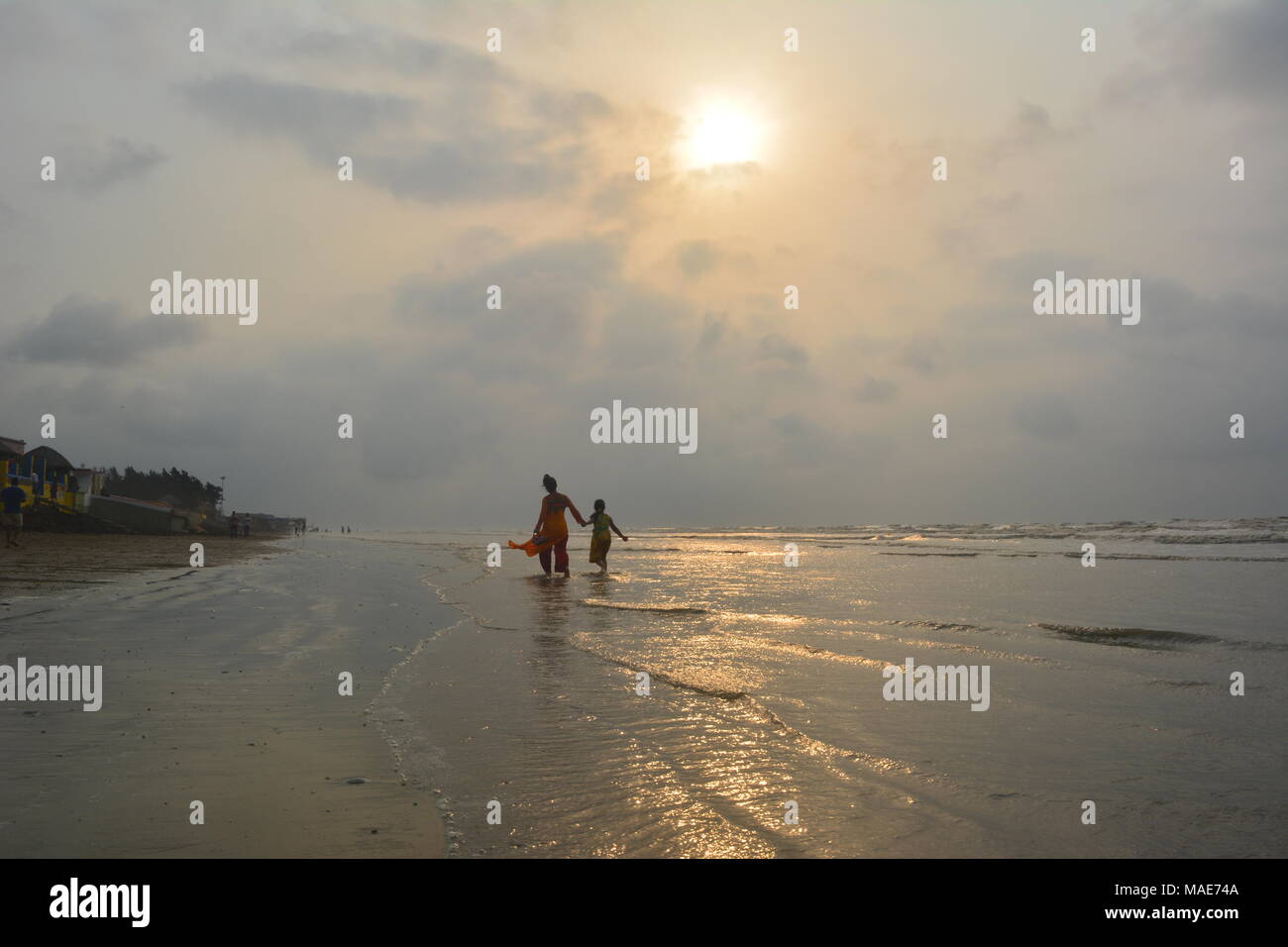 Mandarmani , West Bengal, India. 30th March 2018. Mother and daughter enjoy at Bay of Bengal at sunrise.Mandarmani is a priceless tourist attraction by Bay of Bengal. Credit: Rupa Ghosh/Alamy Live News. Stock Photo