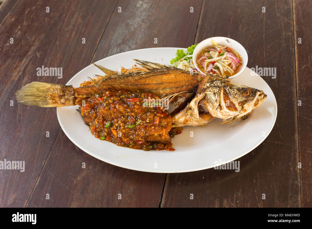 Fish with Chili Sauce Stock Photo Alamy