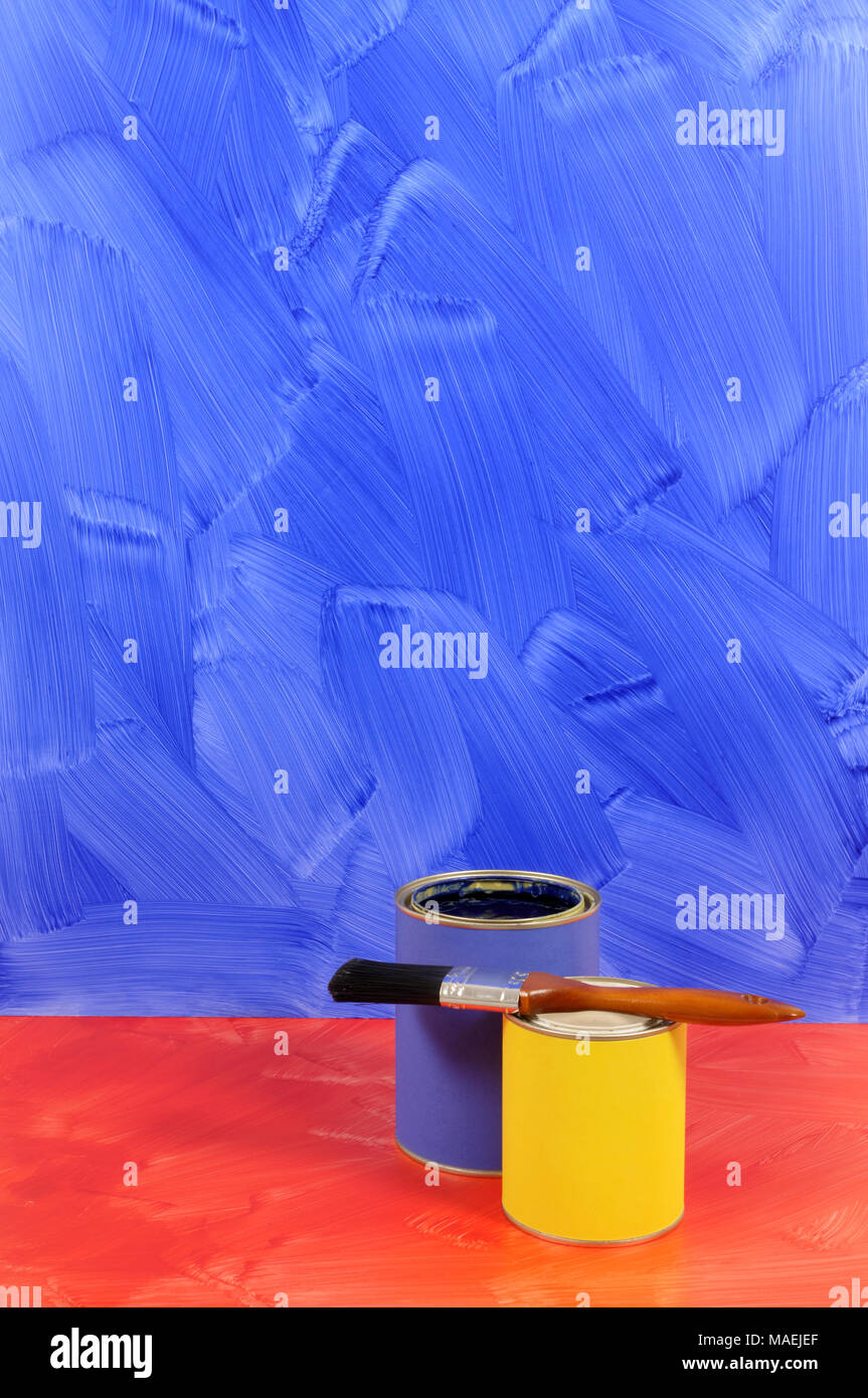 Blue painted wall with red floor and selection of paints (please note that the painted wall and floor have intentionally visible brushstrokes). Stock Photo