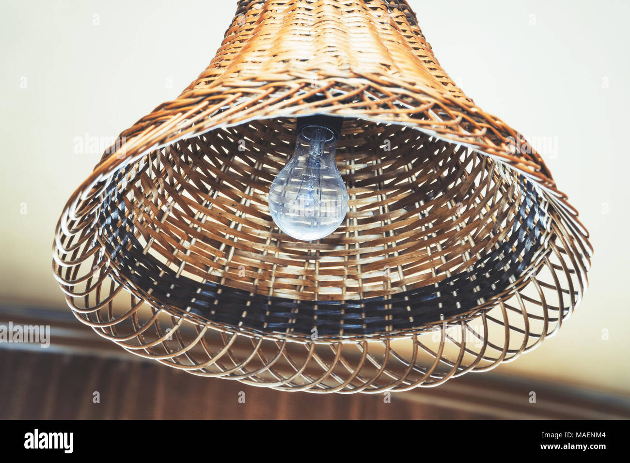 Bulb in a wicker lampshade Stock Photo Alamy