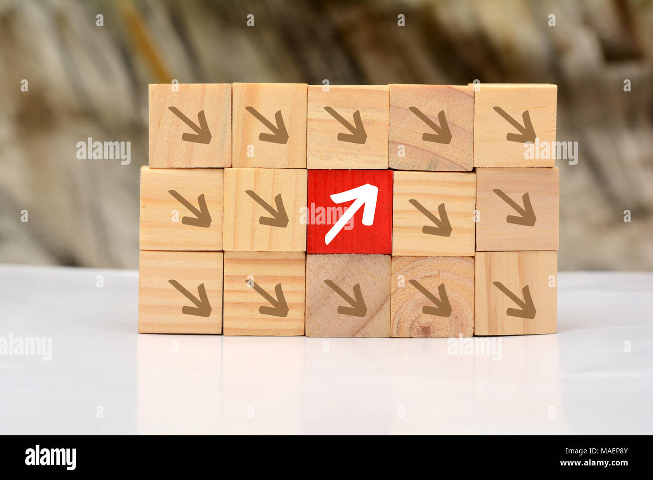 Growing Up concept with wood blocks arrow going upward. Stock Photo