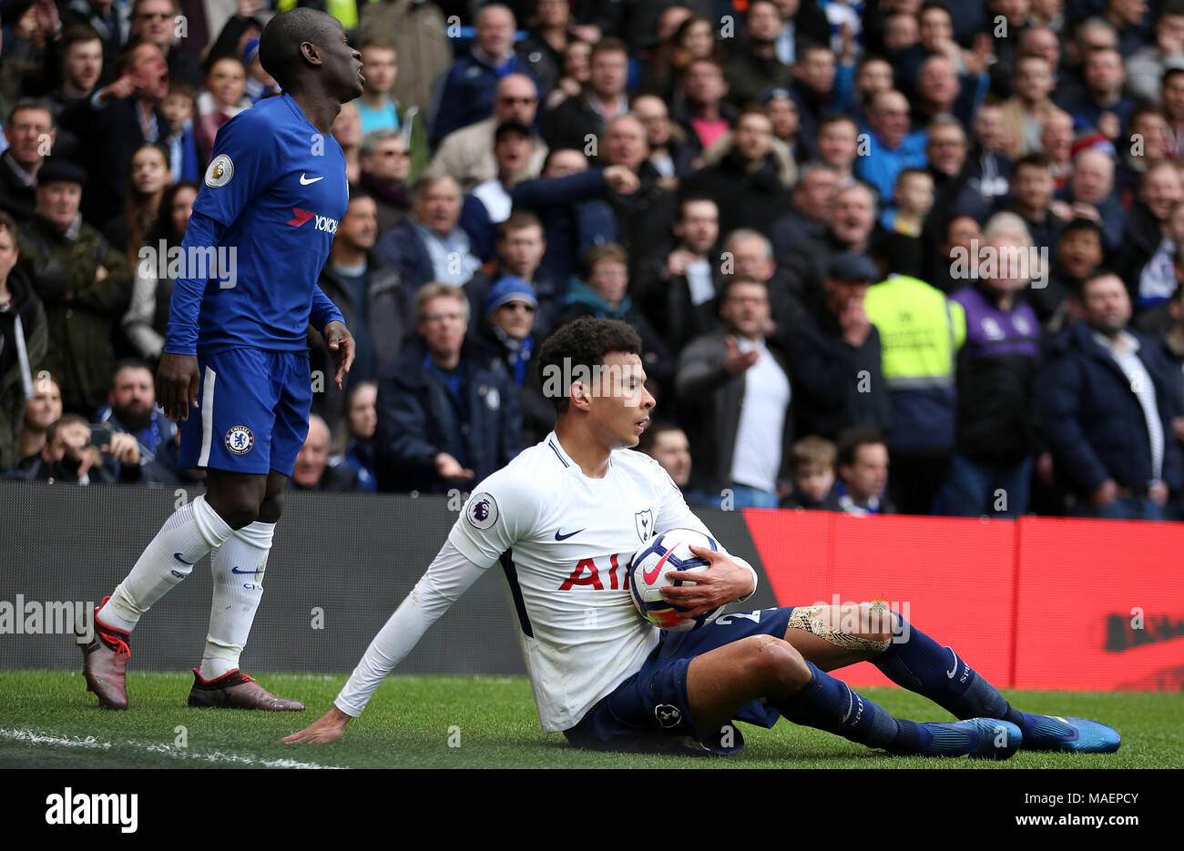 Tottenham Hotspur's Dele Alli (right) reacts to a challenge from