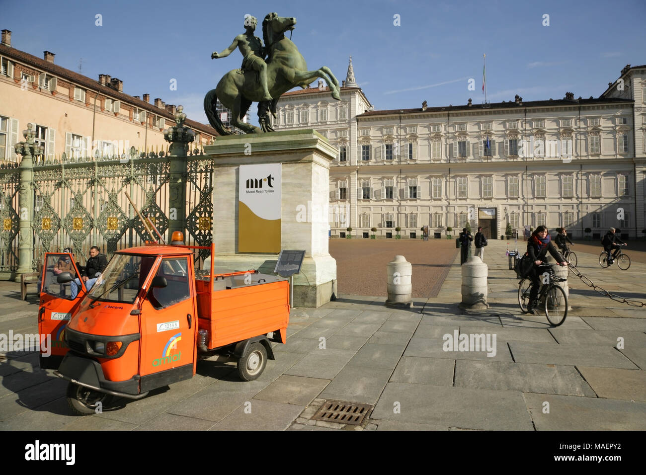 Municipal rubbish collector's Piaggio Ape 50 3-wheeled scooter, in the Piazza Castello with the Piazzetta Reale and Royal Palace behind. Turin, Italy. Stock Photo