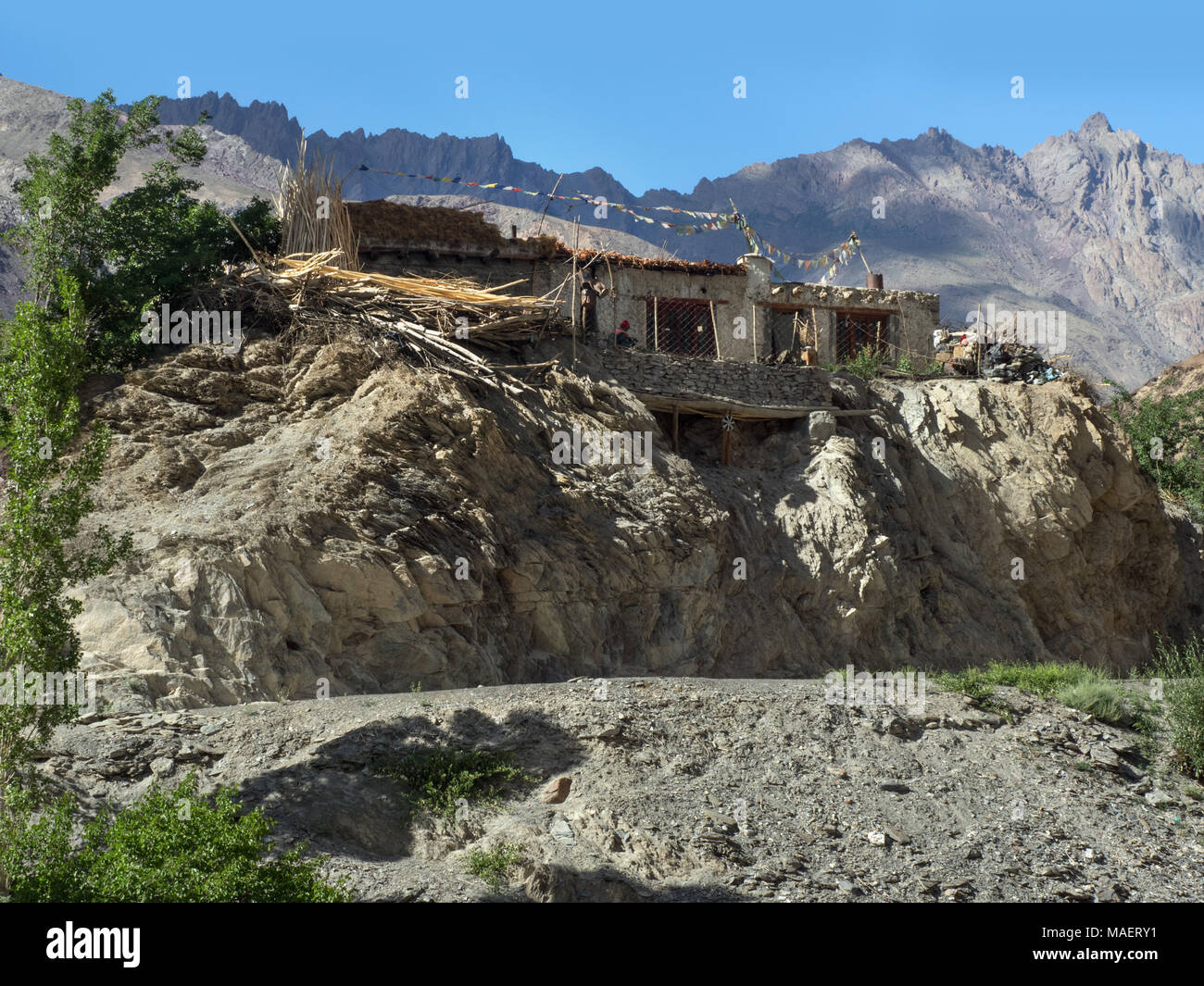 Traditional Tibetan House In A Mountain Village On The Rocks Among The Greenery Tibet Stock Photo Alamy