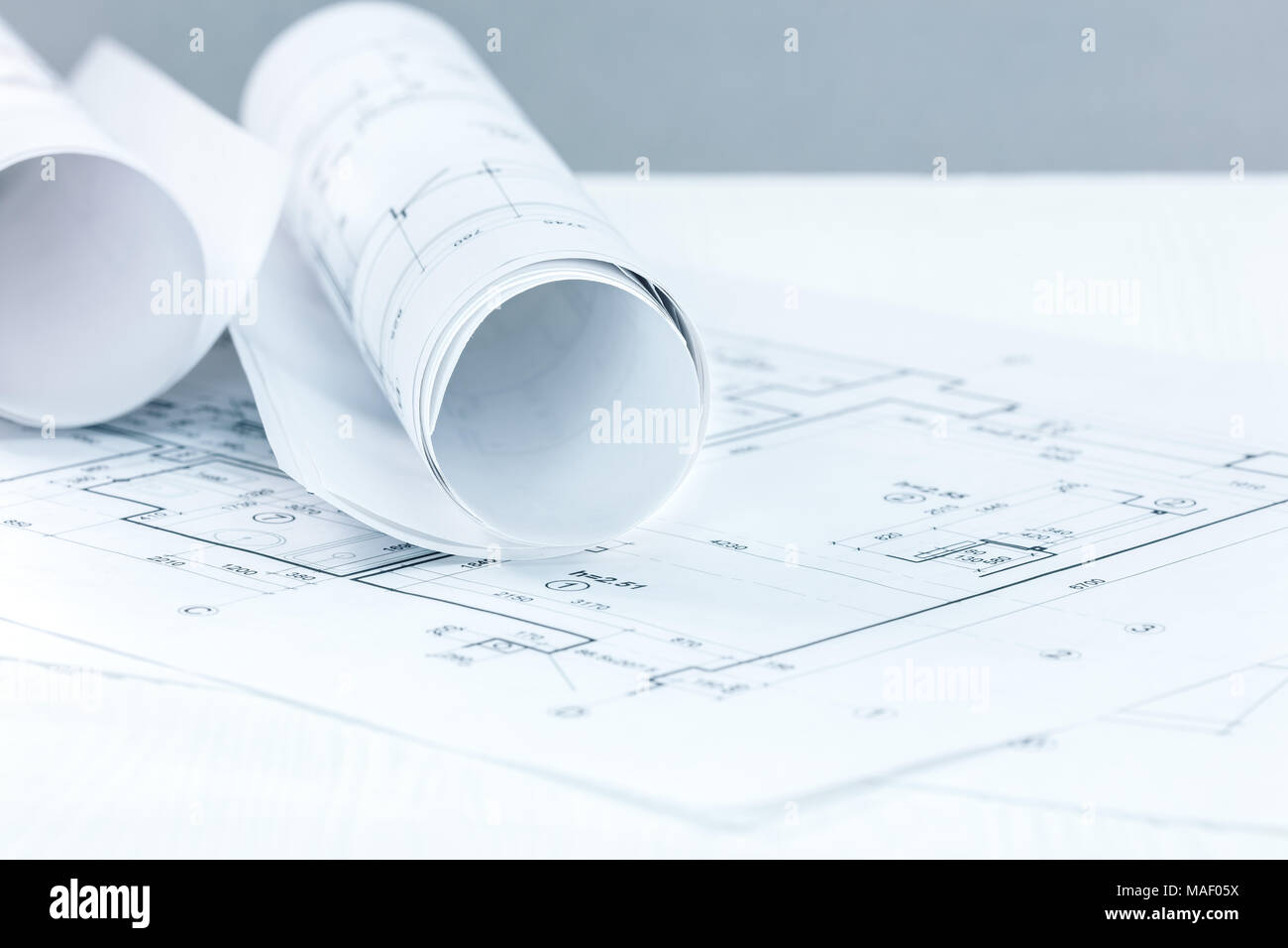 Technical Project Plans And Blueprint Rolls On Grey Blurred Background Stock Photo Alamy alamy