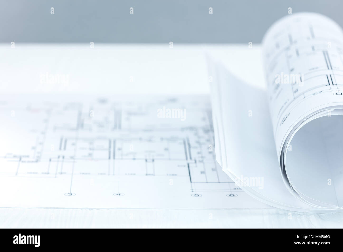 architect workplace. blueprint rolls and technical drawings on desk ...