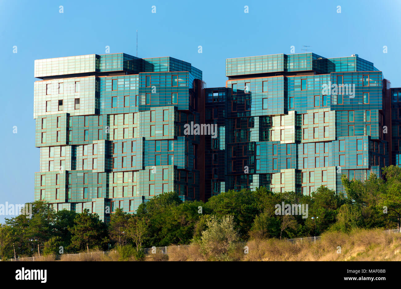 Modern building mirror facade in blue tone Stock Photo