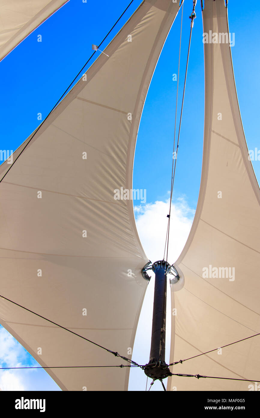 triangle modern luxury awning with blue sky and sunshine reflection sail shape Stock Photo