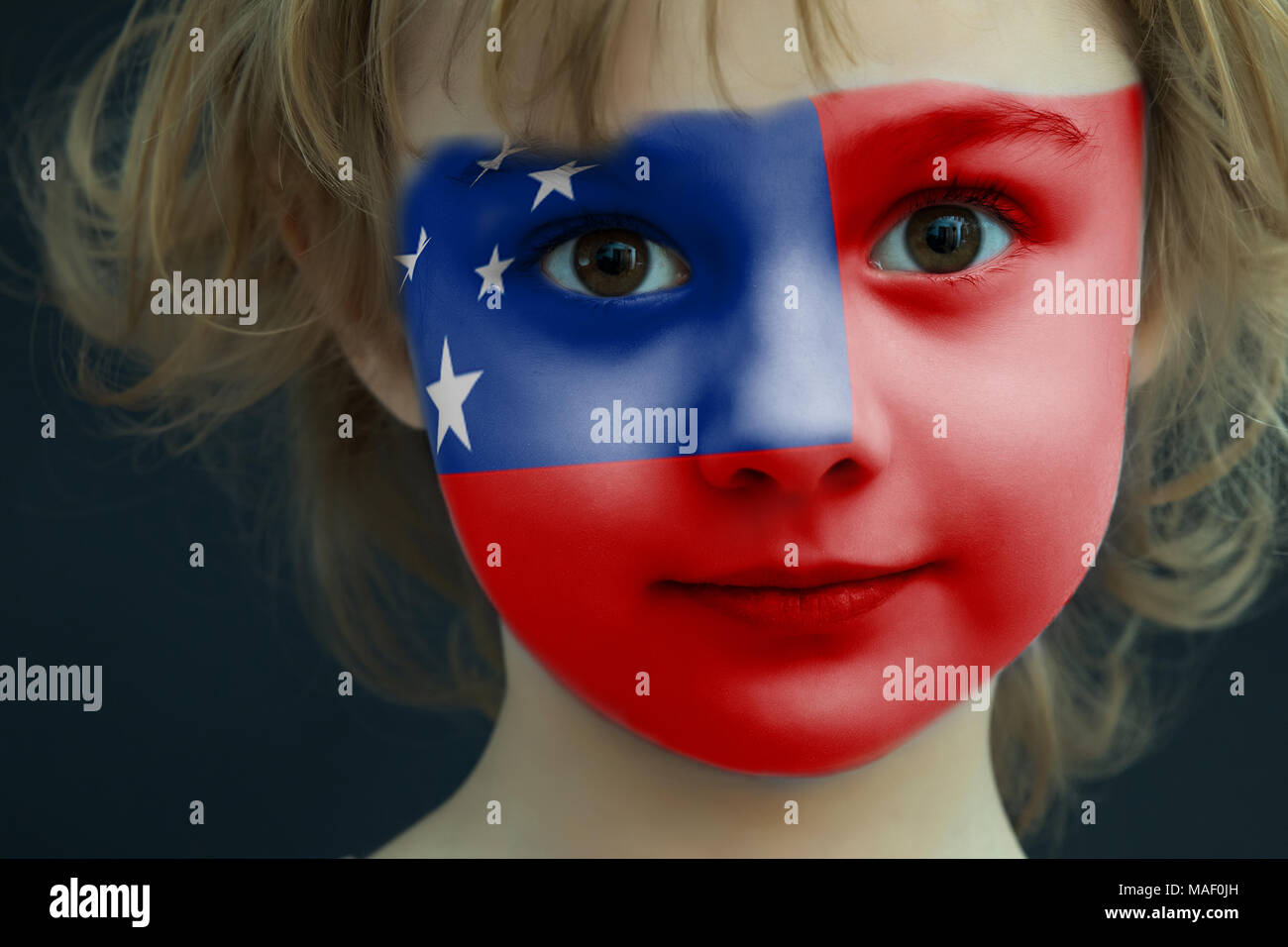 Portrait of a child with a painted Samoa flag Stock Photo