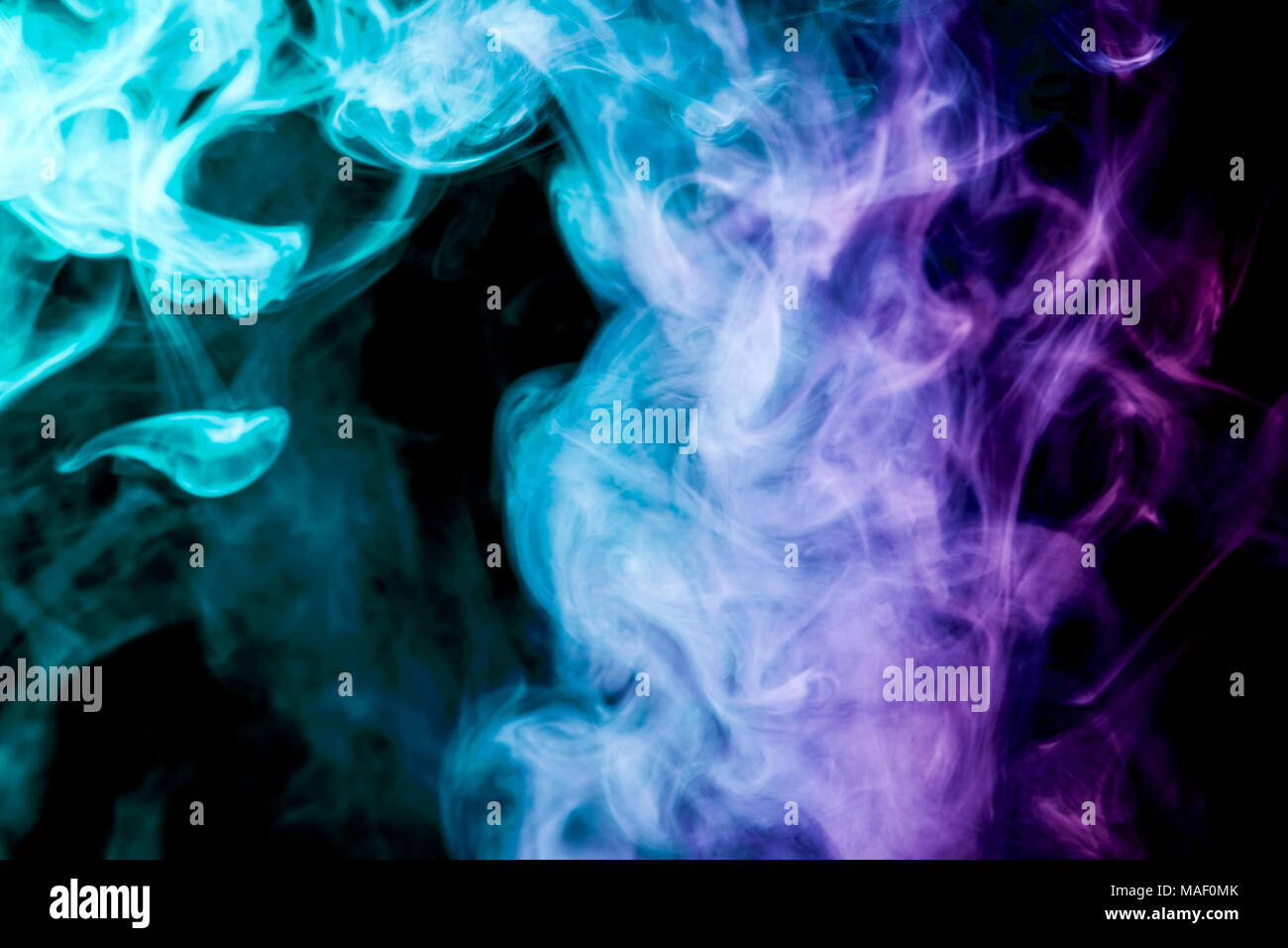 Dense Multicolored Smoke Of Blue Pink And Purple Colors On A Black Isolated Background Background Of Smoke Vape Stock Photo Alamy