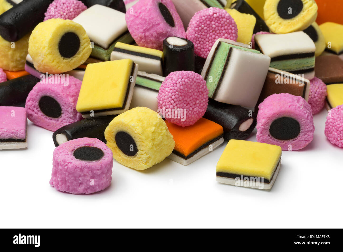 Heap of colorful Liquorice allsorts on white background Stock Photo