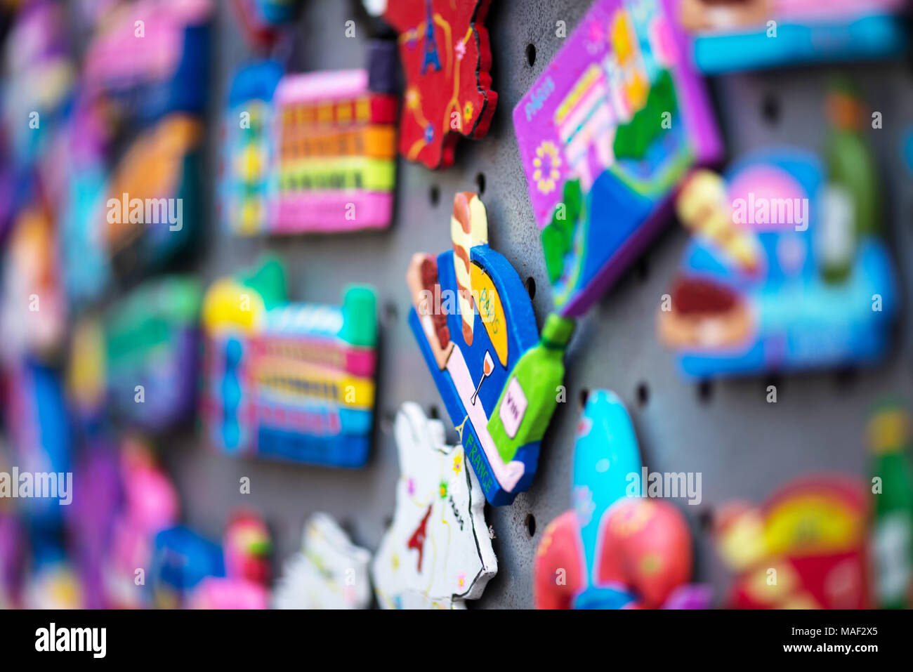 Paris, France - March 20, 2018: fridge magnets close-up. Magnetics for tourists with images of the sights of Paris. Stock Photo
