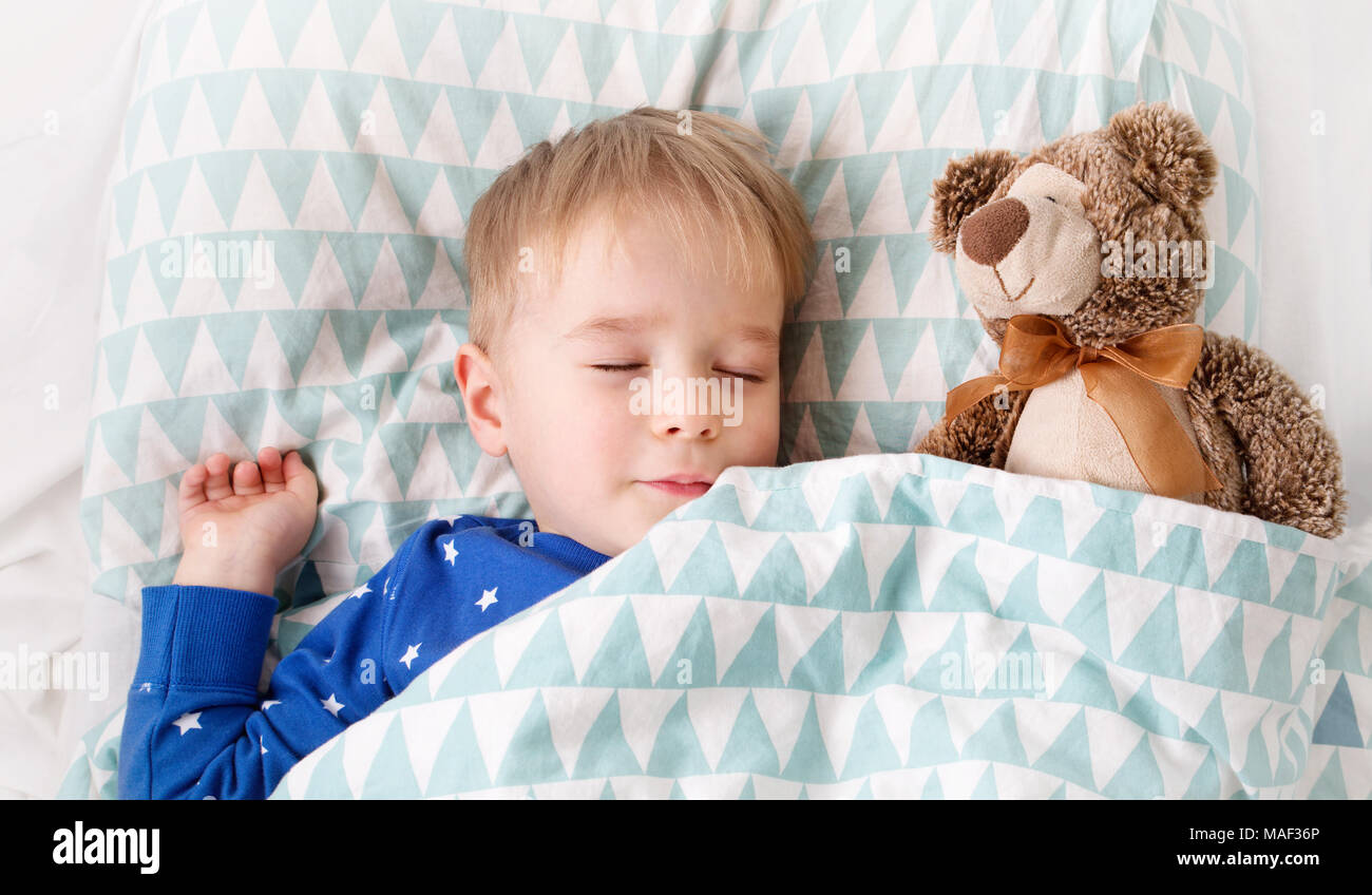 three years old child sleeping in bed Stock Photo Alamy