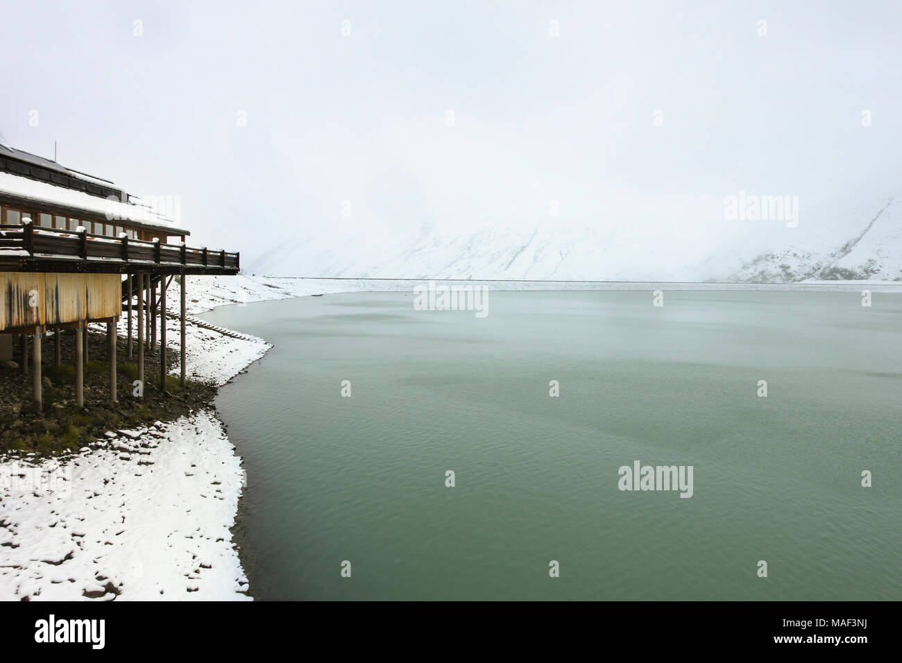 The Silvretta Reservoir Lake Near Galtur Austria With Snow In The