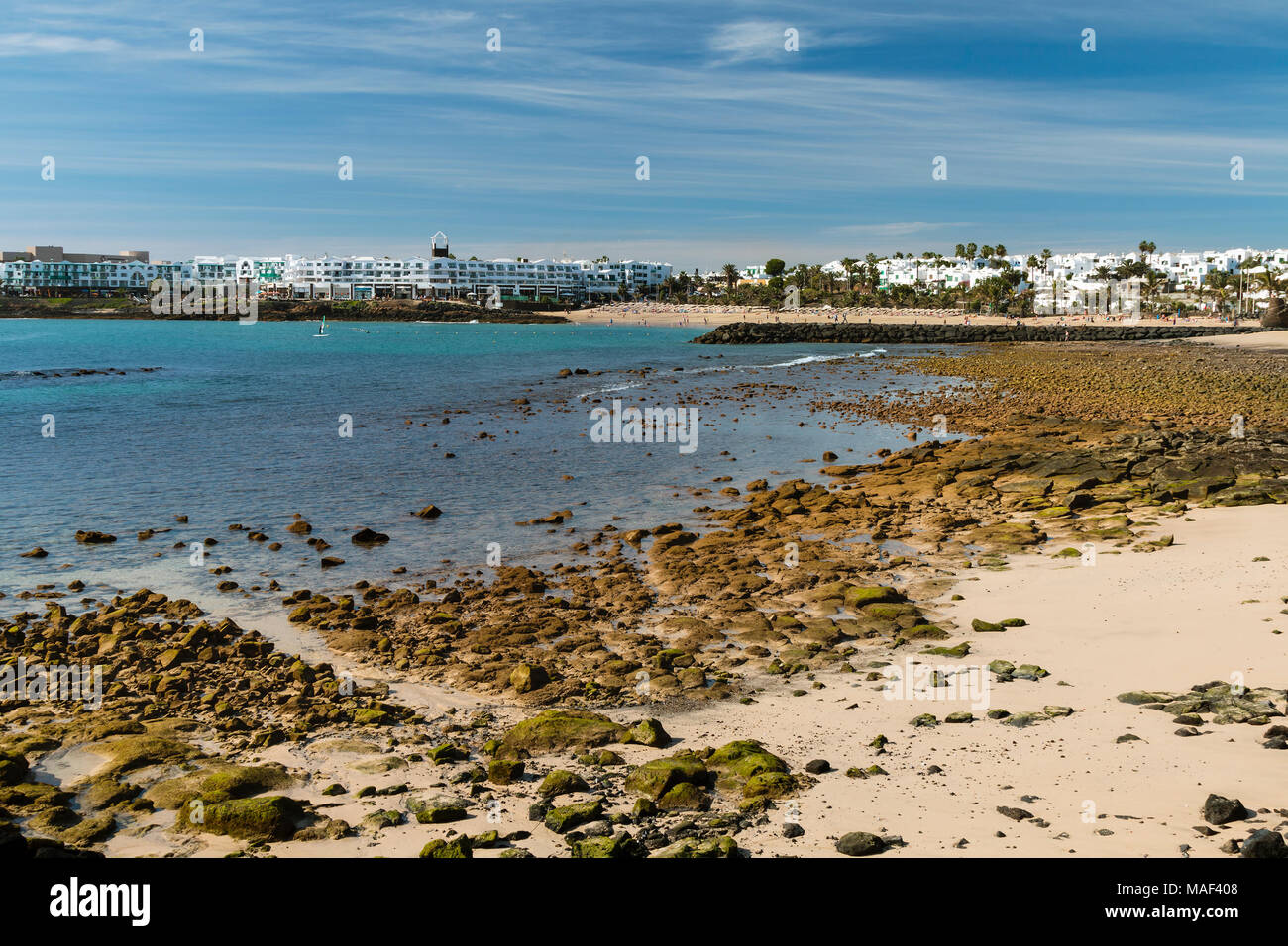 Costa Teguise Beach in Lanzarote, Spain with the village in the background. Stock Photo