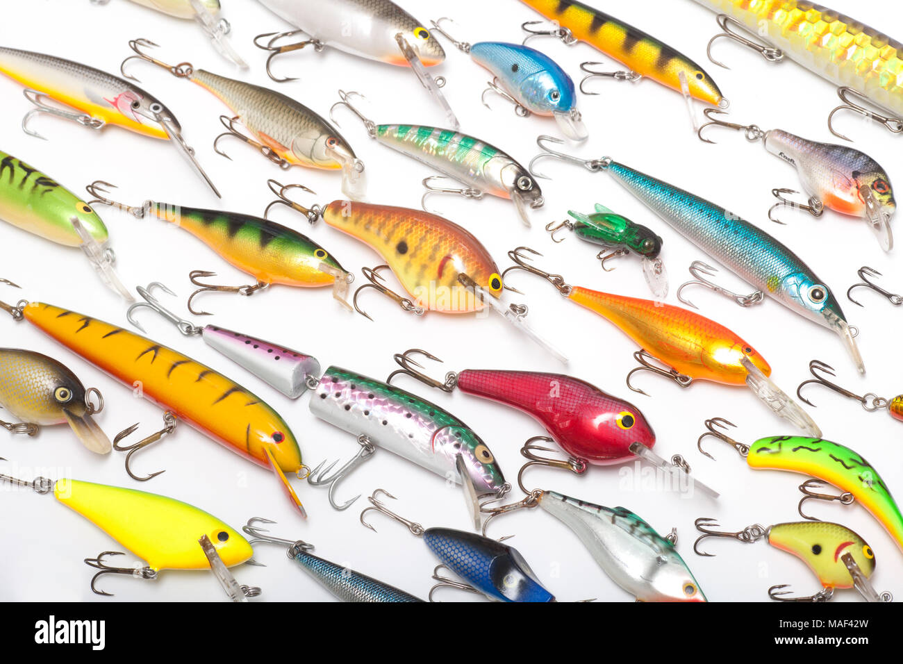 A collection of modern fishing lures also known as plugs for catching predatory fish on a white background. UK Stock Photo