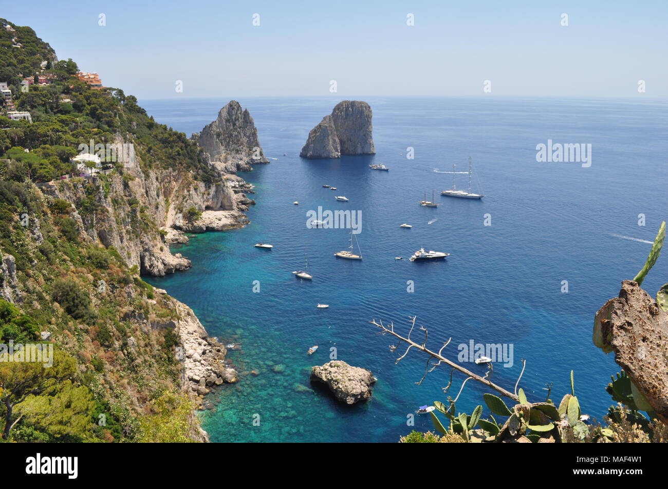 Bay, cliffs and turquoise blue water of Capri island, Italy Stock Photo
