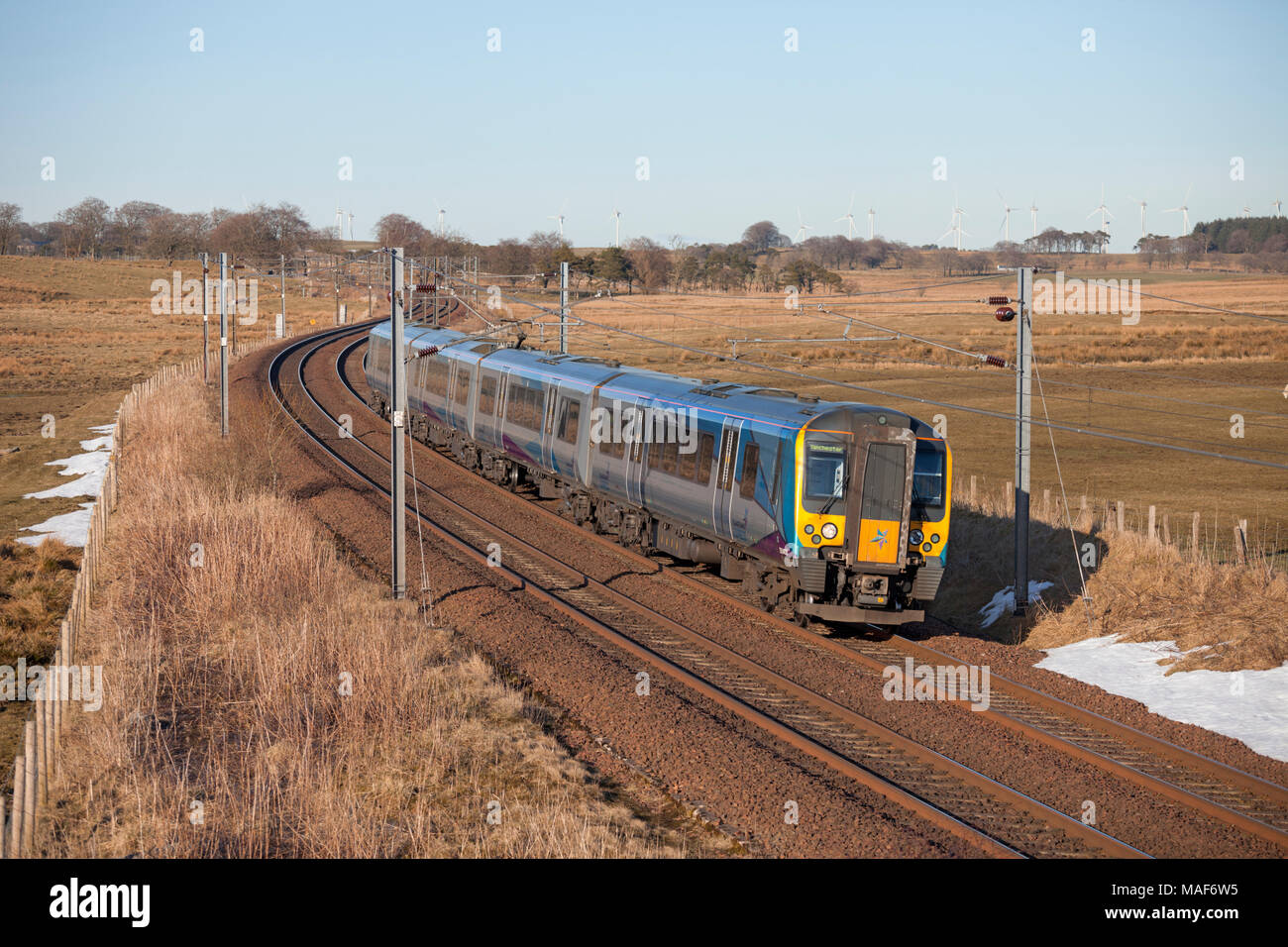 A Transpennine Express class 350 electric train passes Auchengray (between Carstairs and Edinburgh) with  an Edinburgh to Manchester Airport service Stock Photo