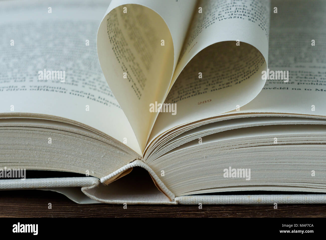 Opened Book With Heart Shaped Page Stock Photo Alamy opened-book-with-heart-shaped-page-stock-photo-alamy
