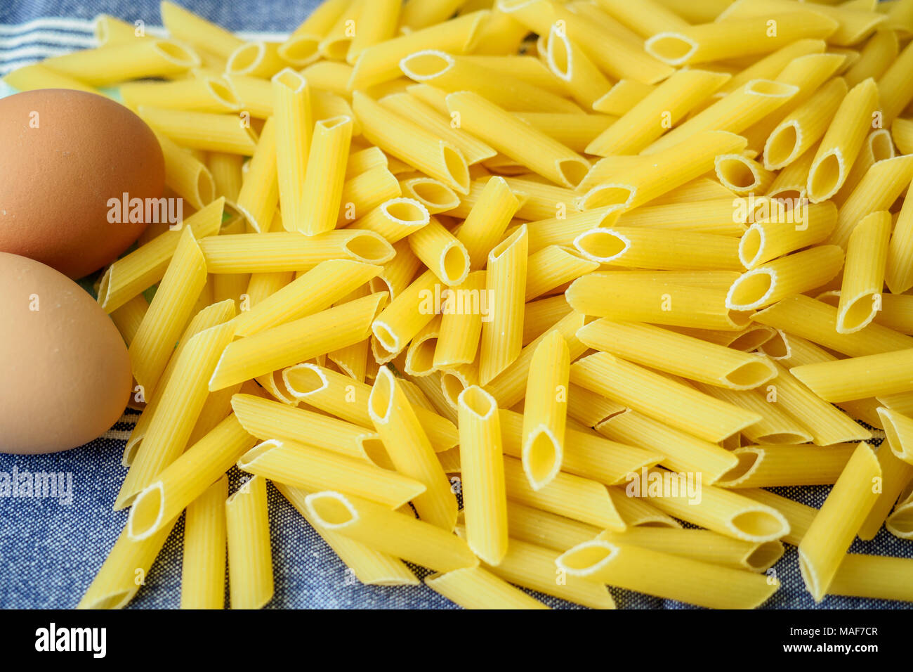 Raw egg pasta. Dried italian penne pasta Stock Photo Alamy