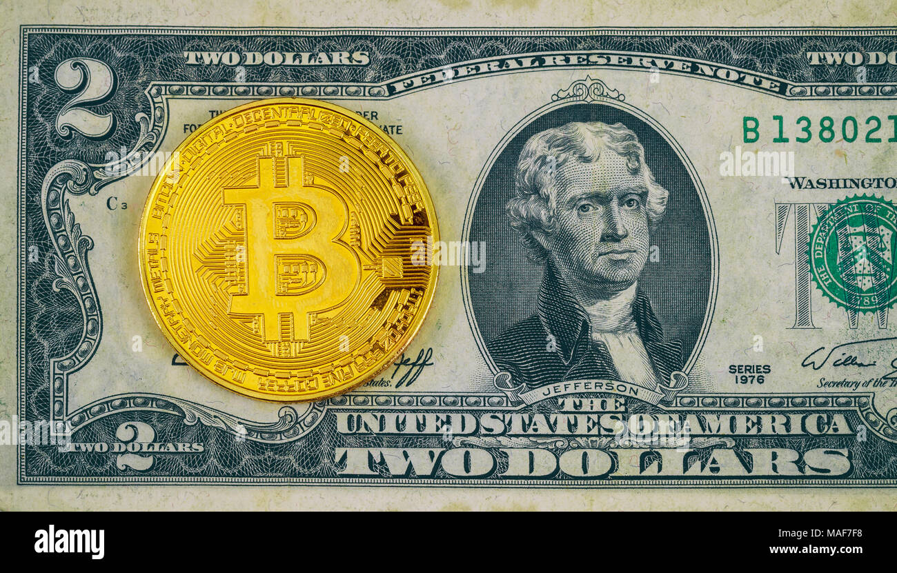 Physical version of Bitcoin new virtual money and banknotes of two dollar.  Exchange bitcoin for a dollar. Conceptual image for worldwide cryptocurrenc  Stock Photo - Alamy