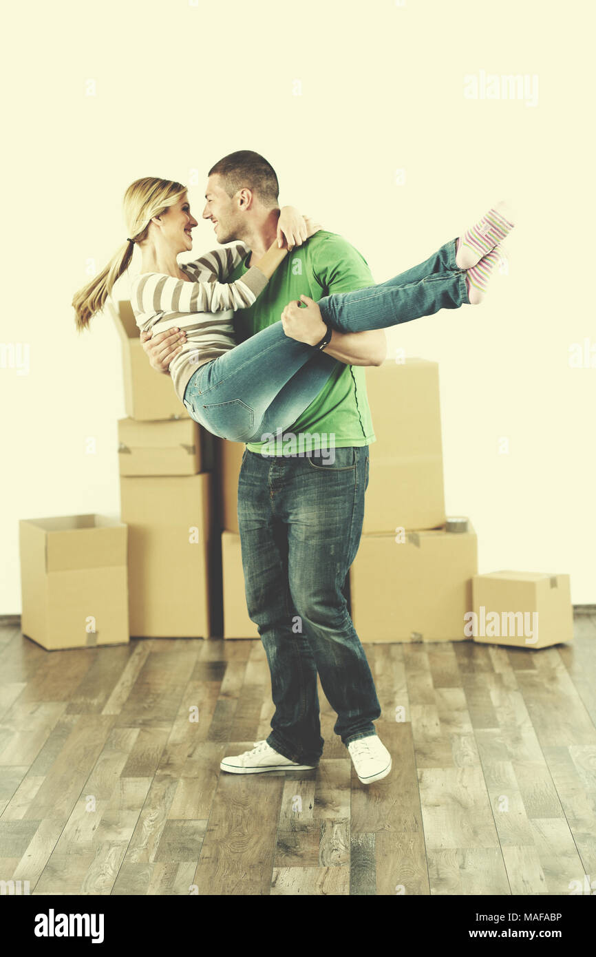 happy Young couple moving in new house Stock Photo - Alamy