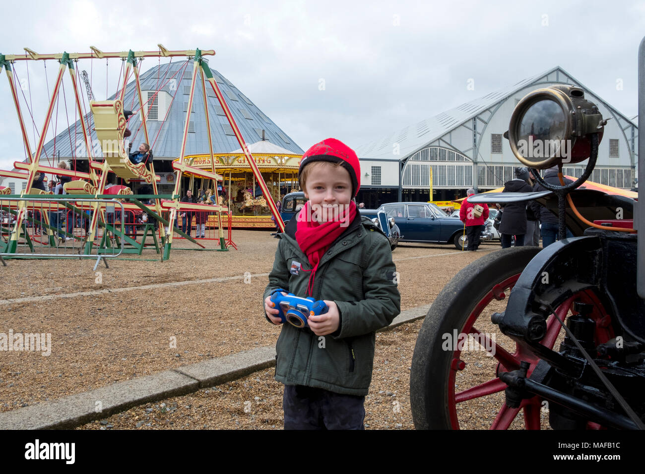 Chatham, Kent, UK 1 April 2018. Six year old Reid Richardson enjoying Classic cars, vintage fair ground rides, steam engines and steam punk at the Ban Stock Photo