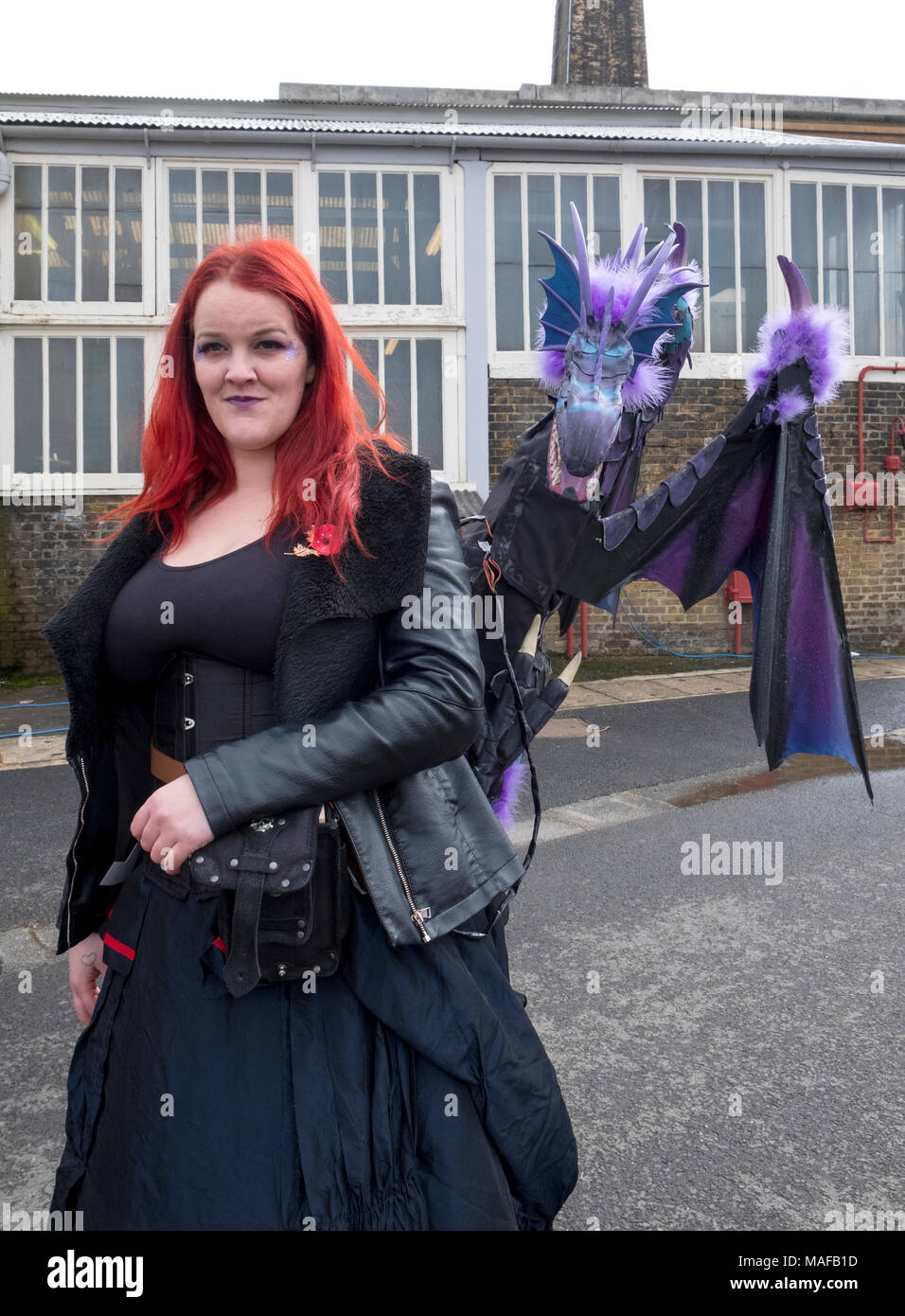 Chatham, Kent, UK 1 April 2018 Steam punk dragon and its handler, Visitors enjoy Classic cars, vintage fair ground rides, steam engines and steam punk Stock Photo