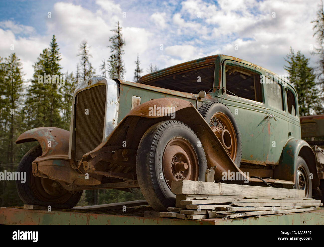 A green 1932 Chevrolet Series BA Confederate four door sedan in an old stone quarry, east of Clark Fork, Idaho. Stock Photo
