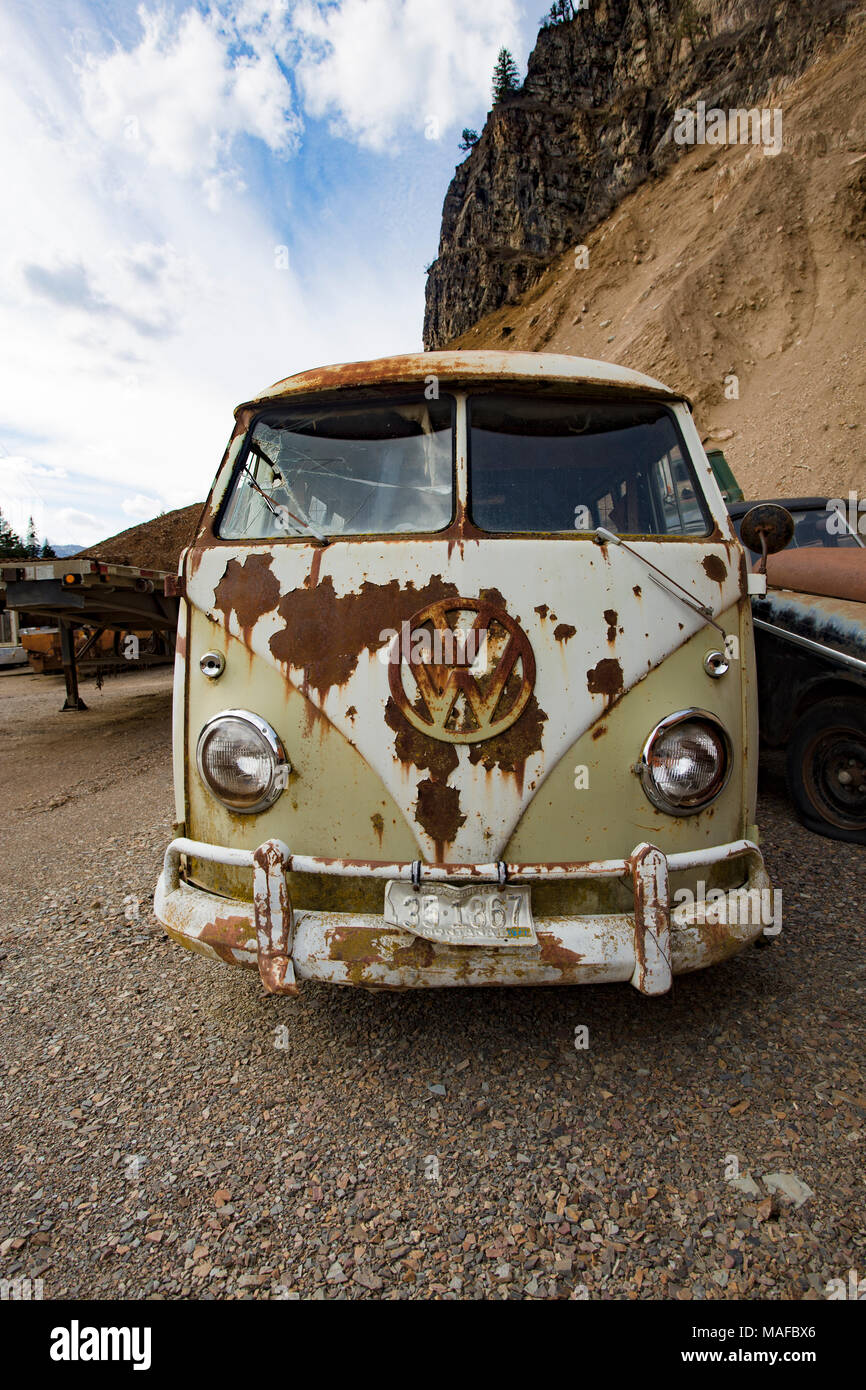 A rusty, lime green 1959 Volkswagen Microbus, in a stone quarry, east of Clark Fork Idaho. Stock Photo