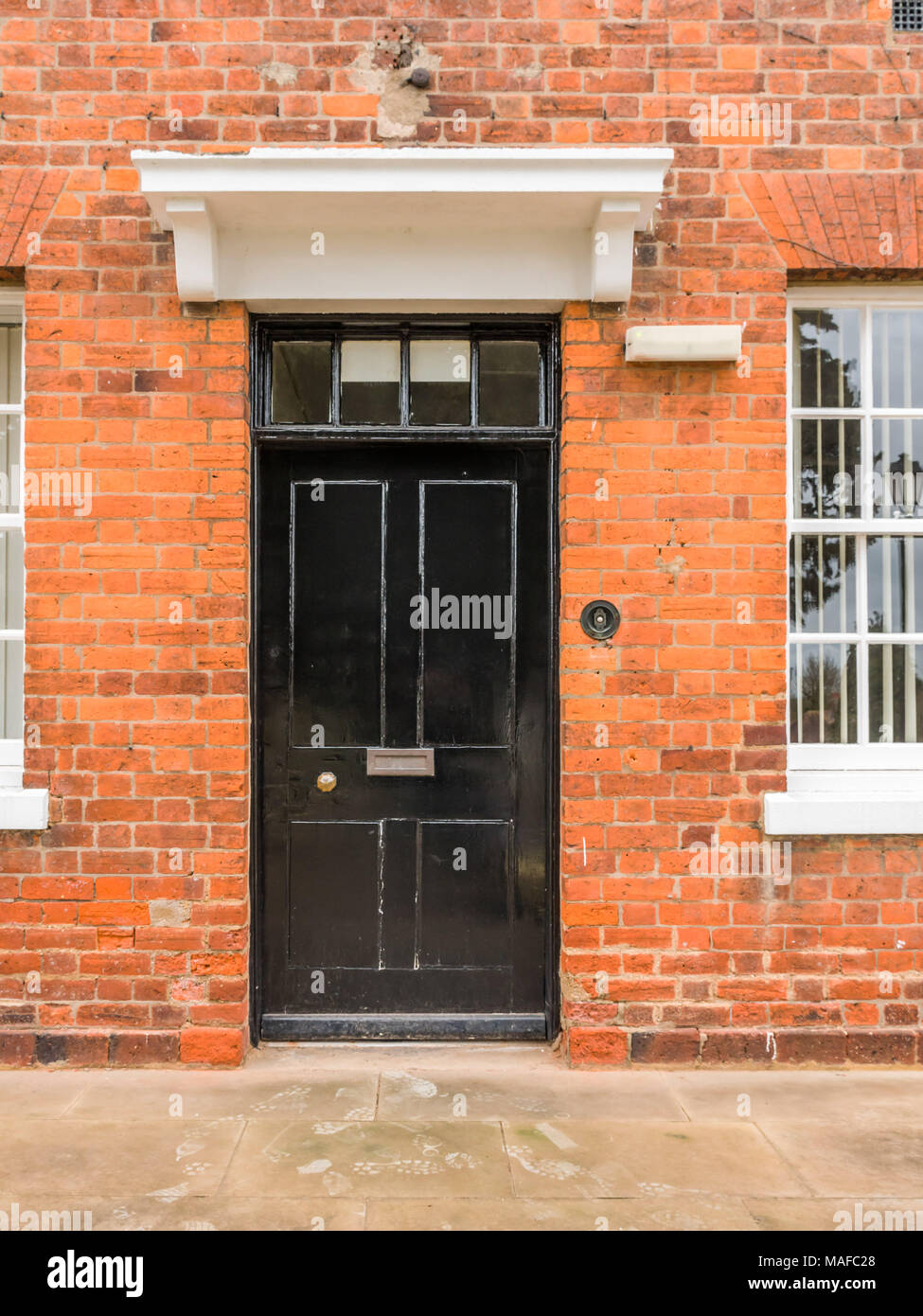 A Row of Brick Buildings with Black Doors on a Street in London Stock Image  - Image of architecture, english: 189002149