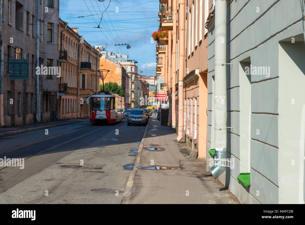 RUSSIA, SAINT PETERSBURG - AUGUST 18, 2017: The city tram goes along Svechny Lane towards Ligovsky Prospekt Stock Photo