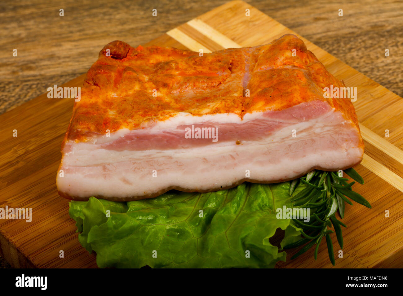 Pork brisket with salad leaves and rosemary Stock Photo Alamy