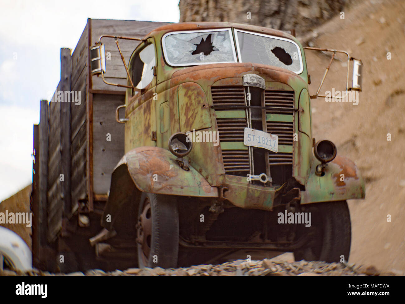 A green 1937 GMC cabover truck, in an old stone quarry, east of Clark Fork Idaho. Stock Photo