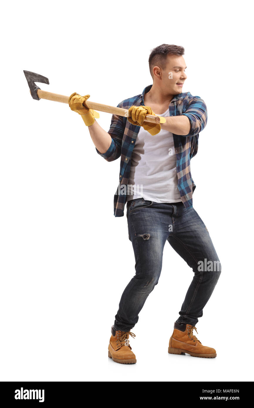 Full length profile shot of a young man with an axe isolated on white background Stock Photo