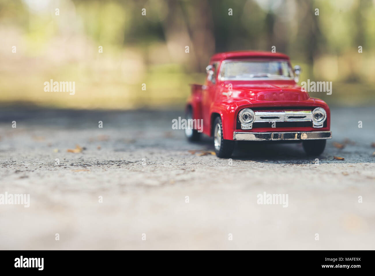 Red car parked at the road Stock Photo - Alamy