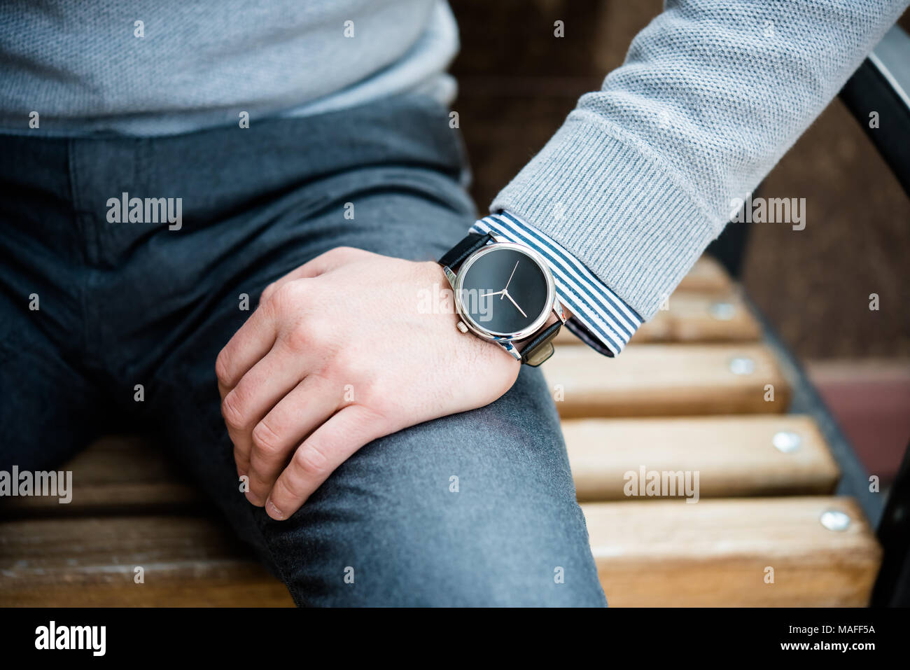 Uensartet sydvest ensom Stylish man in gray jumper, elegant business man's hand with fashion no  brand wrist watch, men fashion and accessories closeup shot Stock Photo -  Alamy