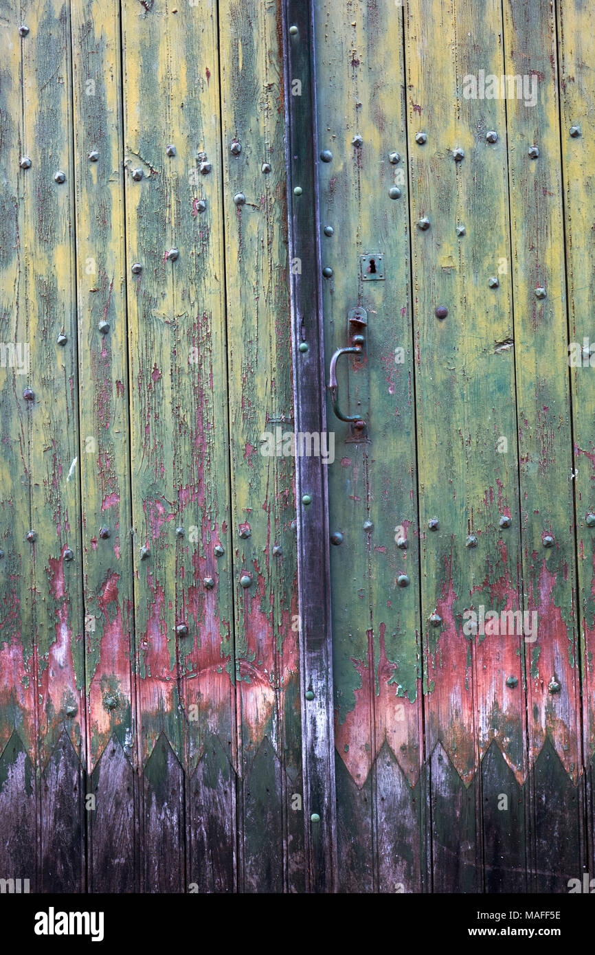 A faded painted closed wooden door Stock Photo
